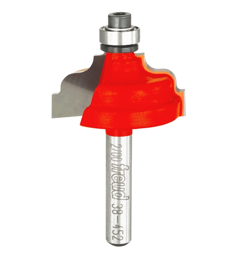 Studio shot of the Freud 38-452 Double Fillet Ogee router bit featuring a red Perma-SHIELD body, Quadra-Cut carbide cutters, 1/4 inch silver shank, and top ball bearing guide.