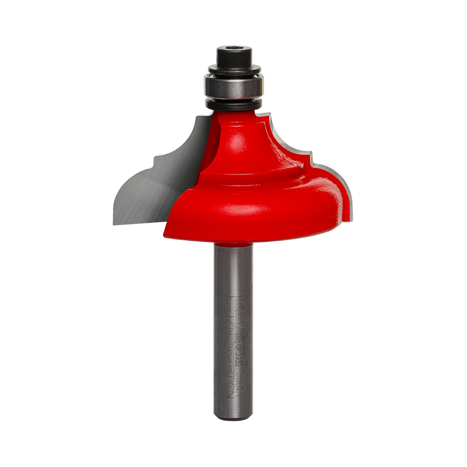 A professional studio photograph of the Freud 38-524 decorative edging bit, featuring its bright red Perma-SHIELD coating on the cutting head, sharp silver Quadra-Cut carbide edges, a top-mounted ball bearing pilot, and a polished 1/4 inch steel shank.