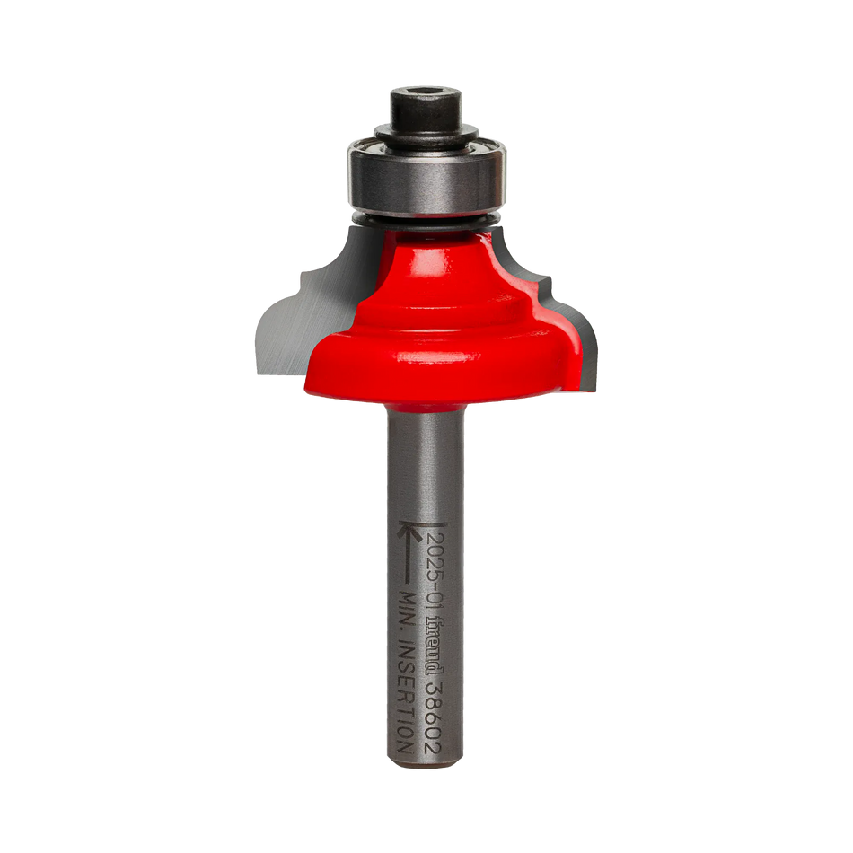 A professional studio photograph of the Freud 38-602 classical cove and round router bit, featuring its signature red Perma-SHIELD coating on the cutting head, silver Quadra-Cut carbide edges, a top-mounted ball bearing pilot, and a polished 1/4 inch steel shank.