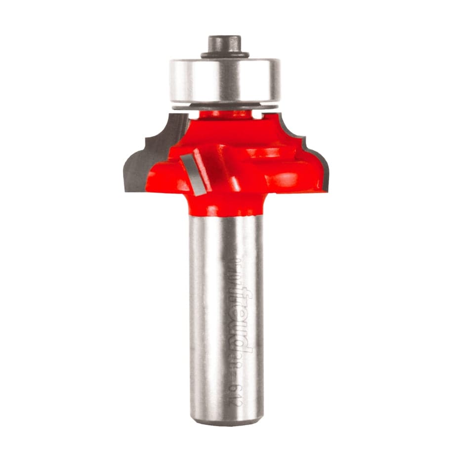 A professional studio photograph of the Freud 38-612 classical cove and round router bit, featuring its signature red Perma-SHIELD coating on the cutting head, silver Quadra-Cut carbide edges, a top-mounted ball bearing pilot, and a polished 1/2 inch steel shank.
