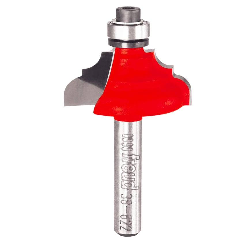 A professional studio photograph of the Freud 38-622 cove and bead router bit, featuring its signature red Perma-SHIELD coating on the cutting head, sharp silver Quadra-Cut carbide edges, a top-mounted ball bearing pilot, and a polished 1/4 inch steel shank.