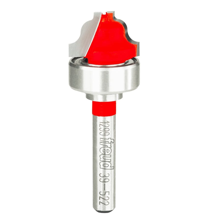 Studio shot of the Freud 39-522 Top Bearing Ogee Fillet Groove router bit featuring a red Perma-SHIELD body, two carbide cutters, 1/4 inch silver shank, and a top-mounted ball bearing.