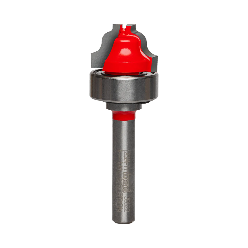 Studio shot of the Freud 39-522 Top Bearing Ogee Fillet Groove router bit featuring a red Perma-SHIELD body, two carbide cutters, 1/4 inch silver shank, and a top-mounted ball bearing.