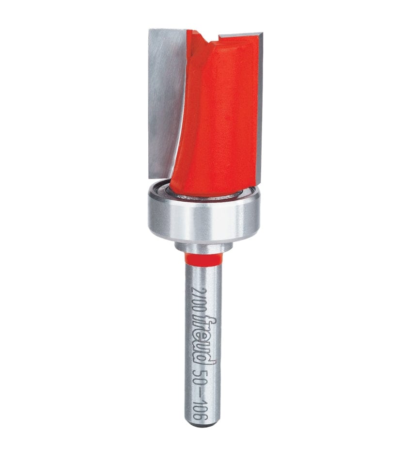 Close-up of Freud flush trim router bit with red coating and top bearing; engraved with model number 50-106.