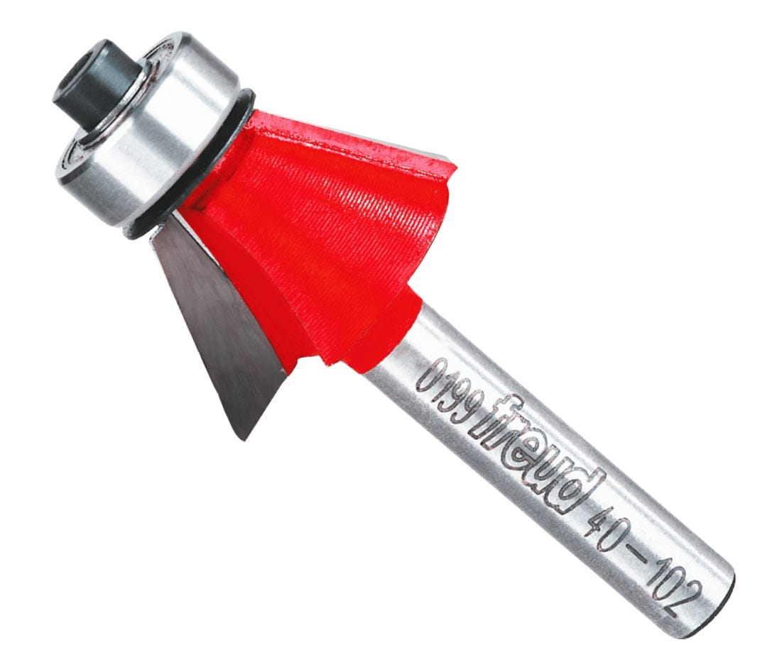 A professional studio product shot of the Freud 40-102 carbide 25-degree chamfer router bit at an angle, showing the sharp carbide cutting head with red Perma-SHIELD coating and a polished 1/4-inch steel shank.