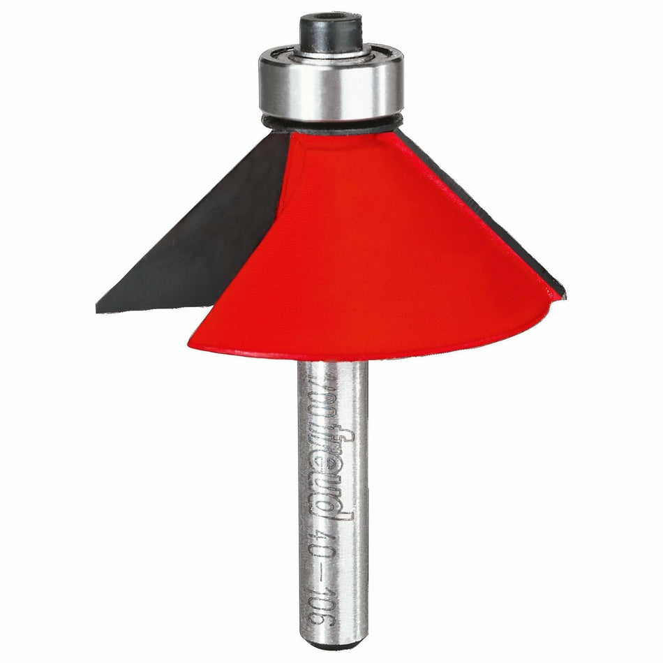 This is a close-up, vertical image of a router bit, specifically a chamfer or bevel bit, which is a tool used for shaping wood edges. It features a prominent red-painted cutting head with two black cutting wings, topped by a metal bearing, and a smooth silver cylindrical shank extending downwards with "freud" branding.