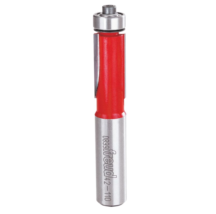 Vertical view of the Freud 42-110 flush trim router bit showing the top-mounted pilot bearing and laser-etched branding on the 1/2 inch silver shank.