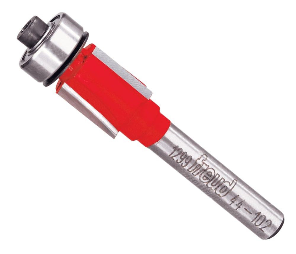Studio shot of the Freud 44-102 Flush Trim router bit featuring a red Perma-SHIELD body, three carbide flutes, 1/4 inch silver shank, and top ball bearing pilot.