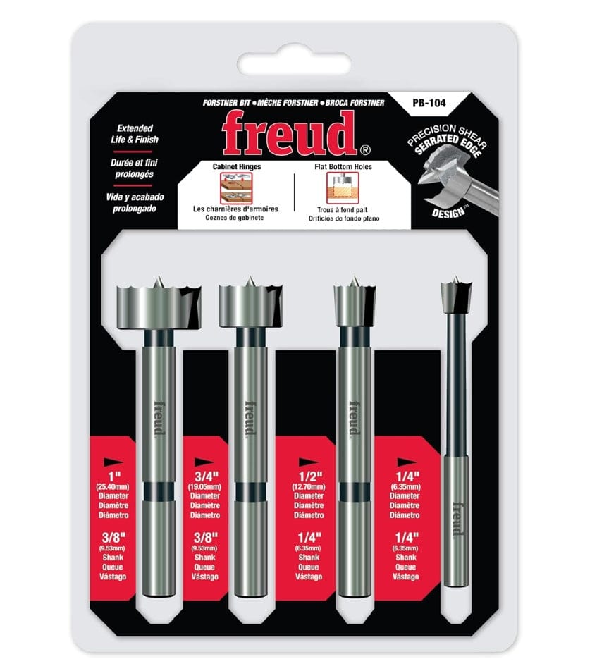 Retail hang-card packaging for the Freud PB-104 4-piece Forstner bit set, displaying bit diameters of 1/4 inch, 1/2 inch, 3/4 inch, and 1 inch with callouts for cabinet hinges and flat-bottom hole applications.