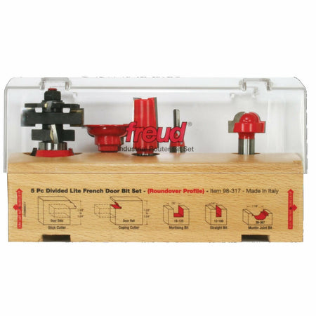 Close-up of the Freud 5-piece Divided Lite French Door Bit Set case, showing the five bits and profile diagrams for the Door Stile (Stick Cutter), Door Rail (Coping Cutter), Mortising Bit, Straight Bit, and Muntin Joint Bit.