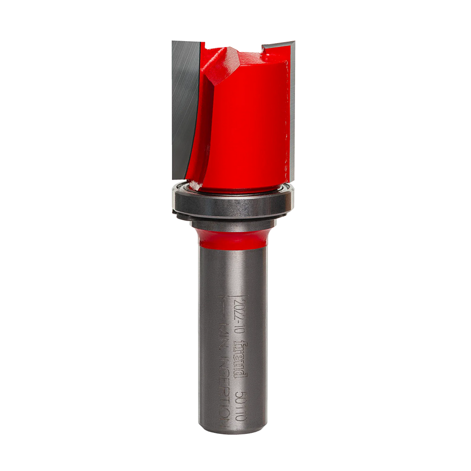 A studio product shot of the Freud 50-138 top bearing flush trim router bit, featuring a silver 1/2-inch shank, a vibrant red dual-flute body, and a silver pilot bearing mounted at the top of the carbide cutters.
