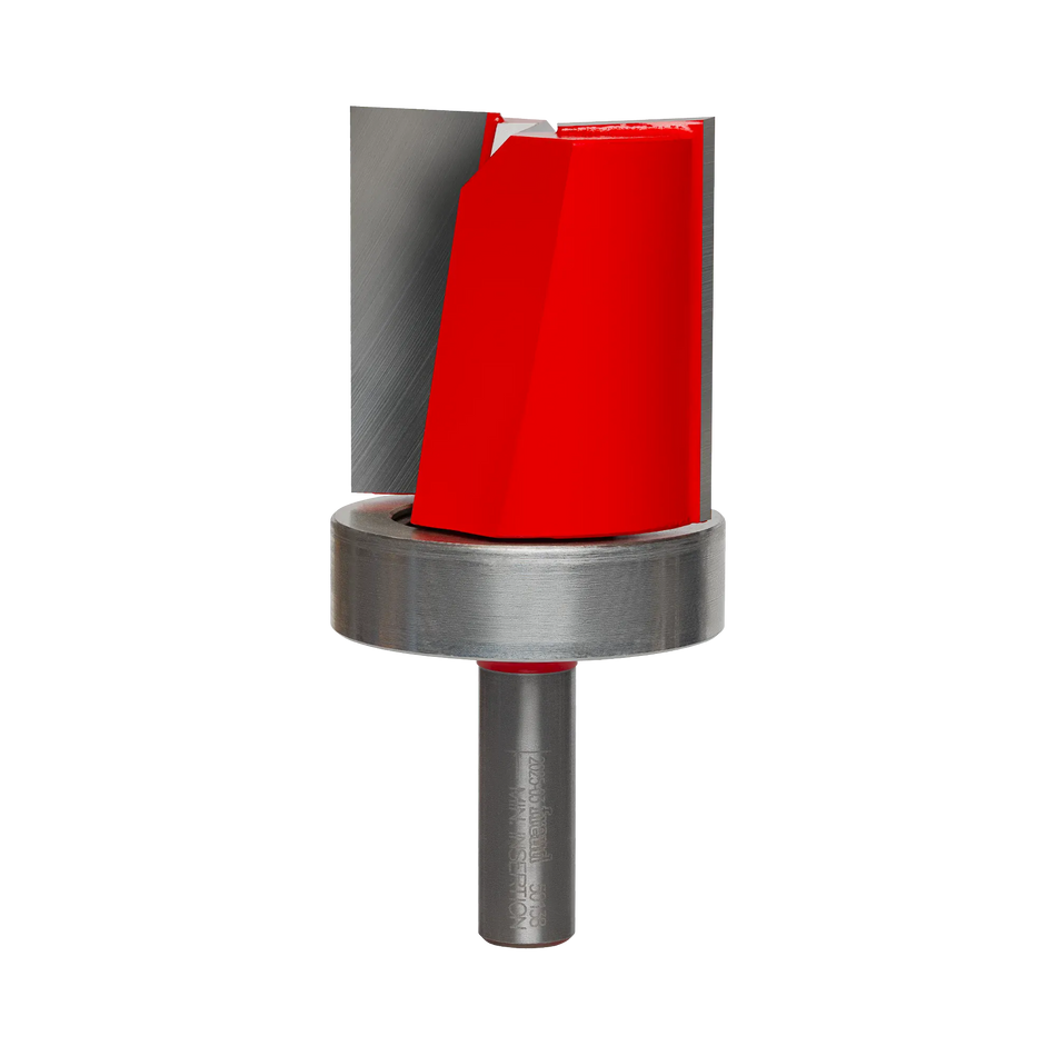 A studio product shot of the Freud 50-138 top bearing flush trim router bit, featuring a red-coated body with silver carbide cutting edges, a large top-mounted ball bearing, and a polished silver shank.