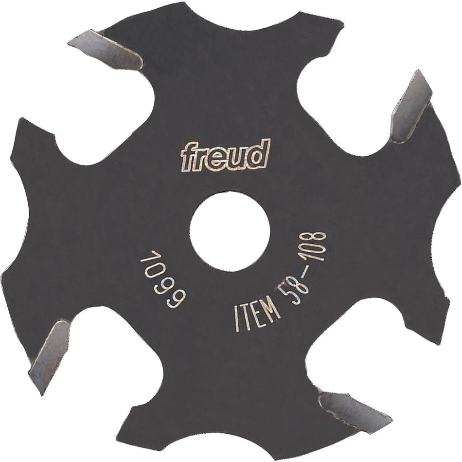 A studio product shot of the Freud 58-108 4-wing slotting cutter, featuring a black-coated body with four silver carbide cutting tips and a center bore for arbor mounting.