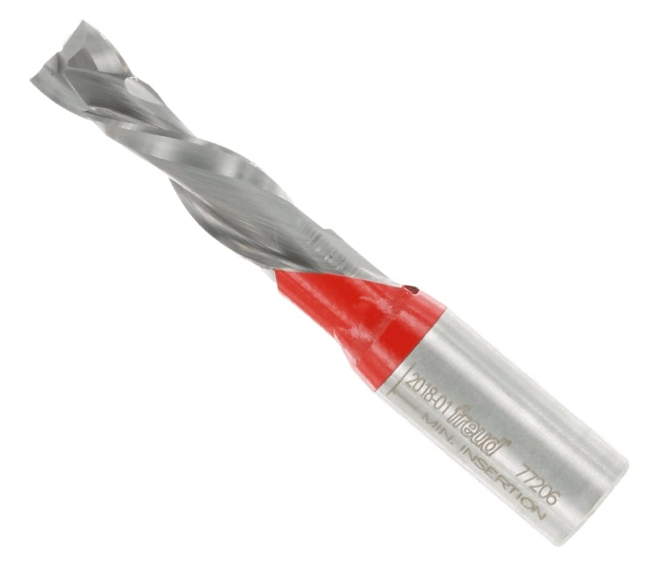A close-up view of the Freud 77-206 double compression spiral router bit at an angle, featuring a silver carbide body, a red-coated neck section, and laser-etched model information on the shank.