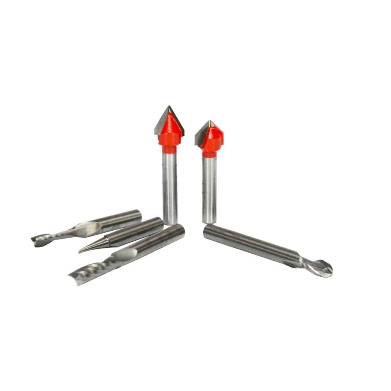 Close-up of six CNC router bits with cylindrical shanks and diverse cutting geometries. Includes spiral, straight, and chamfer-style bits, some with red-tipped heads for specialized cutting applications