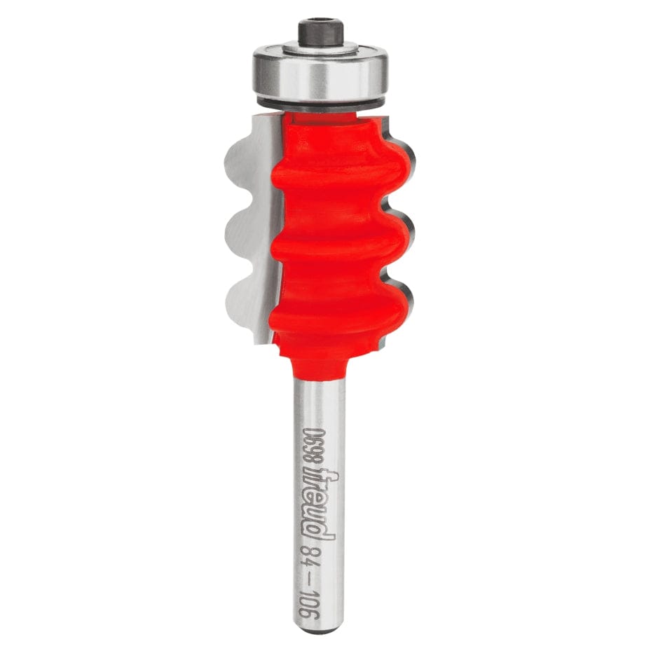 A studio product shot of the Freud 84-106 triple beading and fluting router bit, featuring a silver 1/4-inch shank, a vibrant red triple-profiled body, and a top-mounted silver pilot bearing.