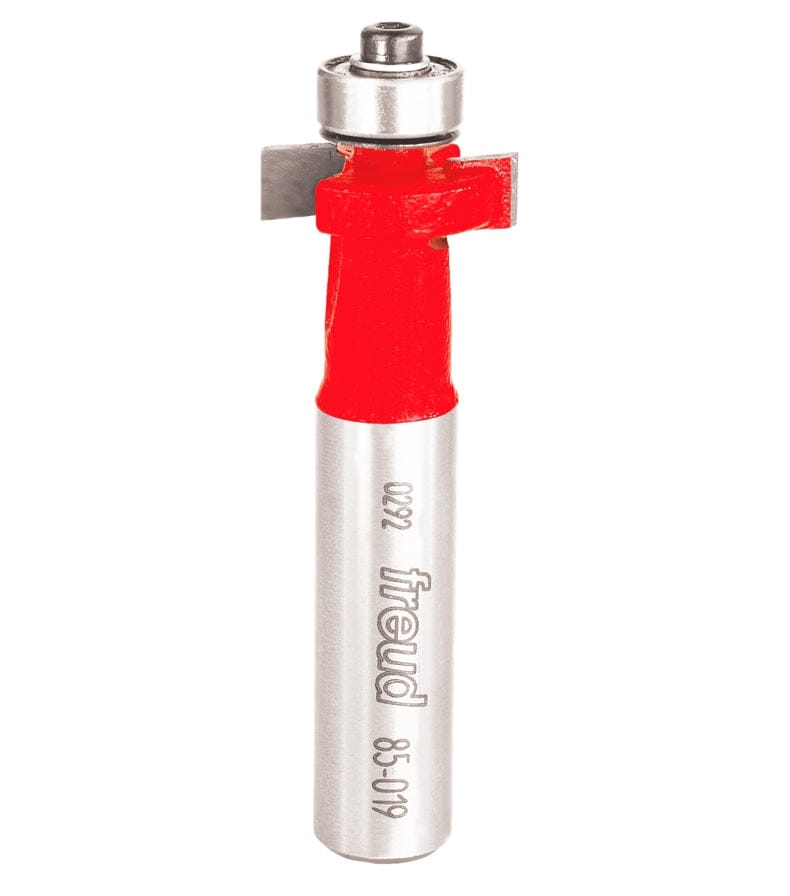 Studio shot of the Freud 85-019 solid surface inlay router bit standing upright, featuring a red body, carbide cutters, and a top-mounted ball bearing guide on a 1/2 inch shank.