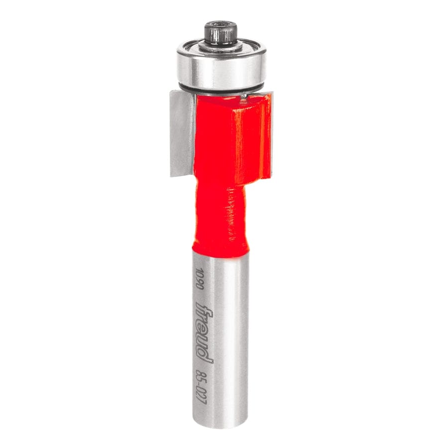 Studio shot of the Freud 85-027 inlay router bit standing upright, featuring a red Perma-SHIELD body, straight carbide cutters, and a top-mounted ball bearing guide on a 1/2 inch shank.