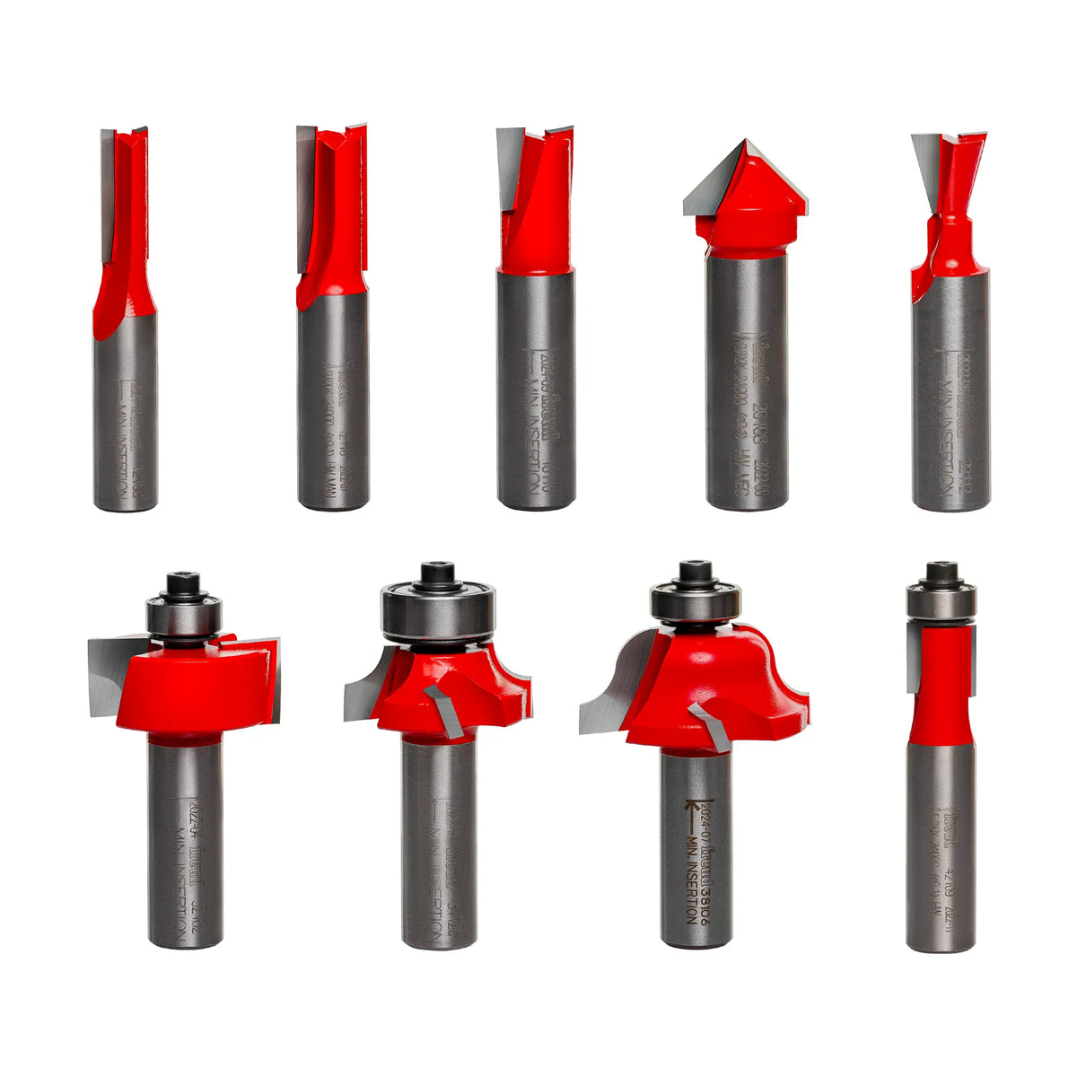 Image of nine Freud router bits arranged in two rows. Each bit has a unique cutting shape, including straight, V-groove, dovetail, rounding over, ogee, rabbeting, and flush trim profiles. Some bits include bearing guides for edge-following precision