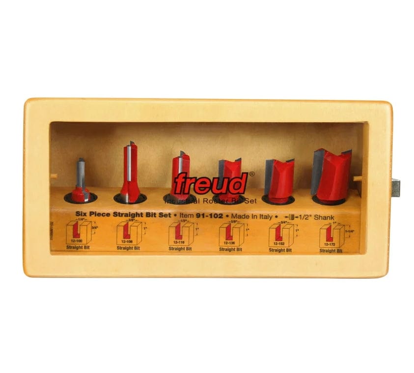 The Freud 91-102 6-piece straight router bit set displayed in its wooden storage box with a clear window.