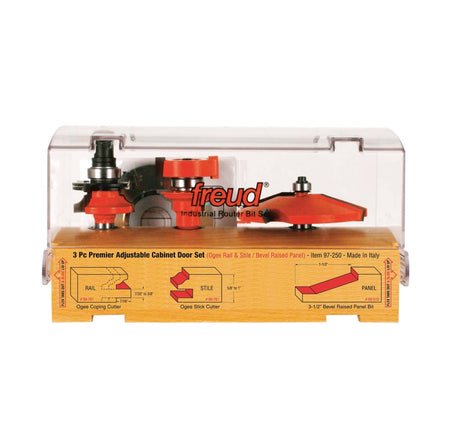 Freud 97-250 adjustable cabinet door bit set organized in a premium wooden storage case with a clear cover, featuring detailed profile diagrams for ogee coping, stick cutters, and bevel raised panel bits.