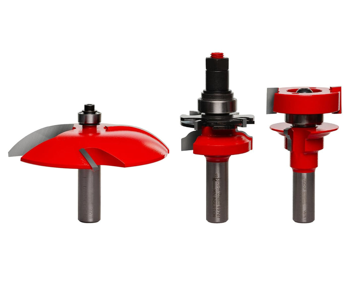 Freud 97-252 3-piece premier adjustable cabinet door router bit set featuring ogee rail and stile bits and a 3-1/2-inch cove profile Quadra-Cut raised panel bit with red Perma-SHIELD coating.