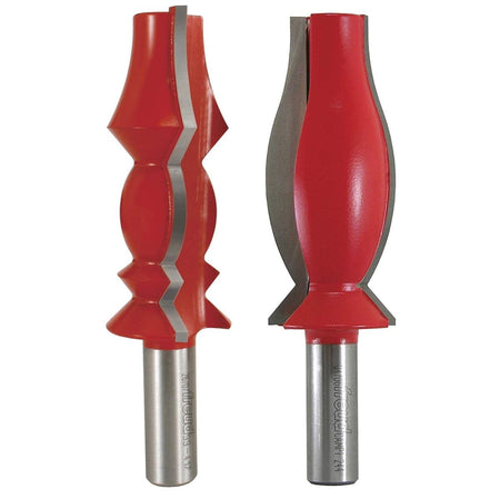 This image displays two large, red router bits with silver cutting edges, designed for shaping wood. They feature ornate, symmetrical profiles, suggesting their use for creating decorative molding or trim.