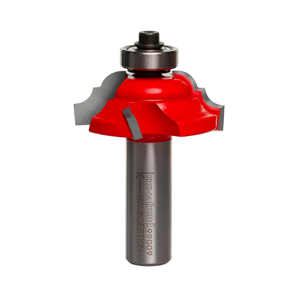 Studio shot of the Freud 99-009 cove and bead router bit standing upright, featuring a red Perma-SHIELD coating, Quadra-Cut four-cutter design, and a ball bearing guide on a 1/2 inch shank.