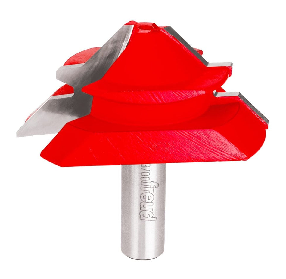 A close-up perspective of the Freud 99-035 lock miter router bit featuring a vibrant red Perma-SHIELD coating and industrial-grade carbide cutters designed for 90-degree interlocking joints.
