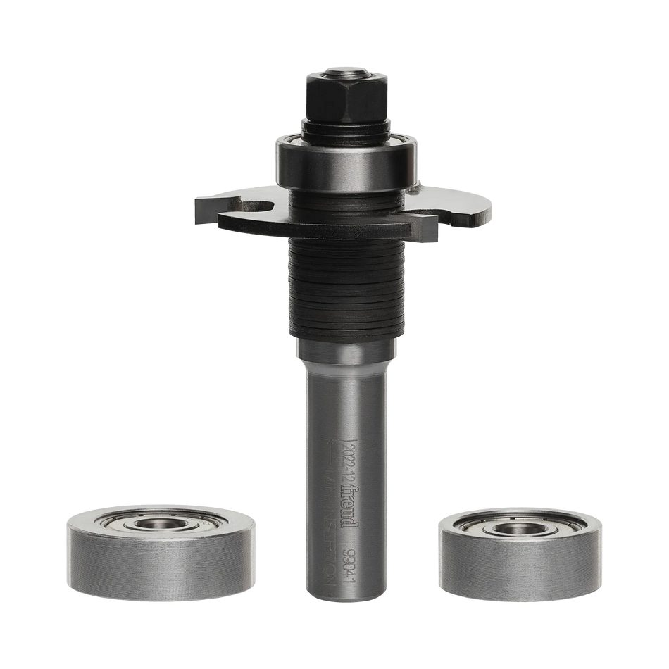 Studio shot of the Freud 99-041 biscuit joining router bit assembly standing upright, featuring a 1/2 inch shank, arbor, and carbide slot cutter, displayed alongside two additional interchangeable silver bearings.