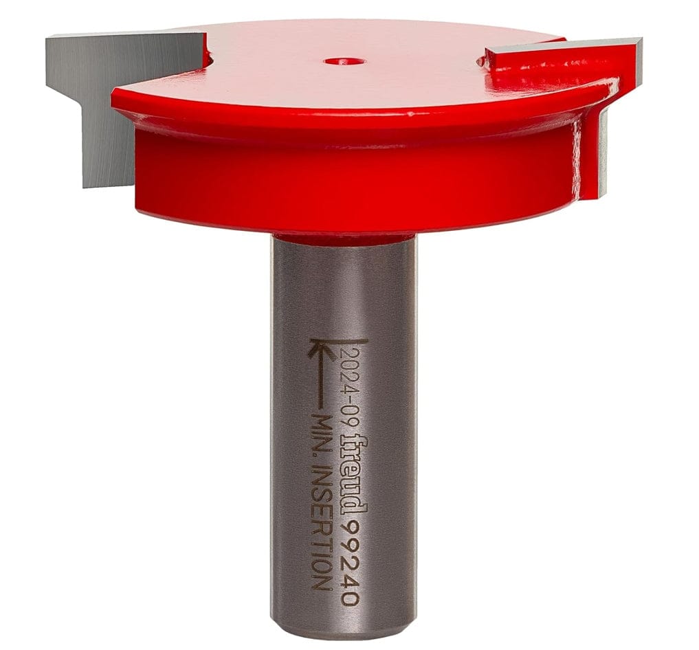 Studio shot of the Freud 99-240 drawer lock router bit standing upright, featuring a wide red Perma-SHIELD body and carbide cutters on a 1/2 inch shank.