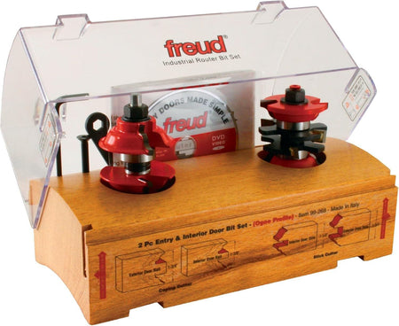 Product view of the Freud 99-268 industrial router bit set in its wooden display case highlighting the coping and stick cutters used for custom 1-3/4 inch thick door fabrication.