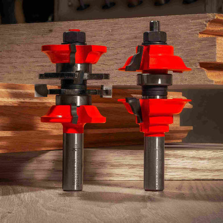 Close-up of the Freud 99-269 1-7/8-inch entry and interior door router bit set displayed next to a custom milled mortise and tenon wood joint.