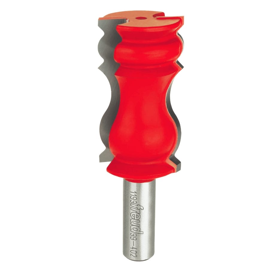 Studio shot of the Freud 99-402 crown molding router bit standing upright, featuring a red Perma-SHIELD body and carbide cutters with a decorative wavy profile on a 1/2 inch shank.