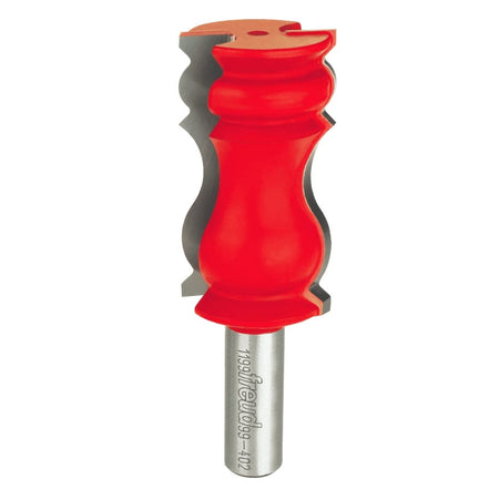 Studio shot of the Freud 99-402 crown molding router bit standing upright, featuring a red Perma-SHIELD body and carbide cutters with a decorative wavy profile on a 1/2 inch shank.