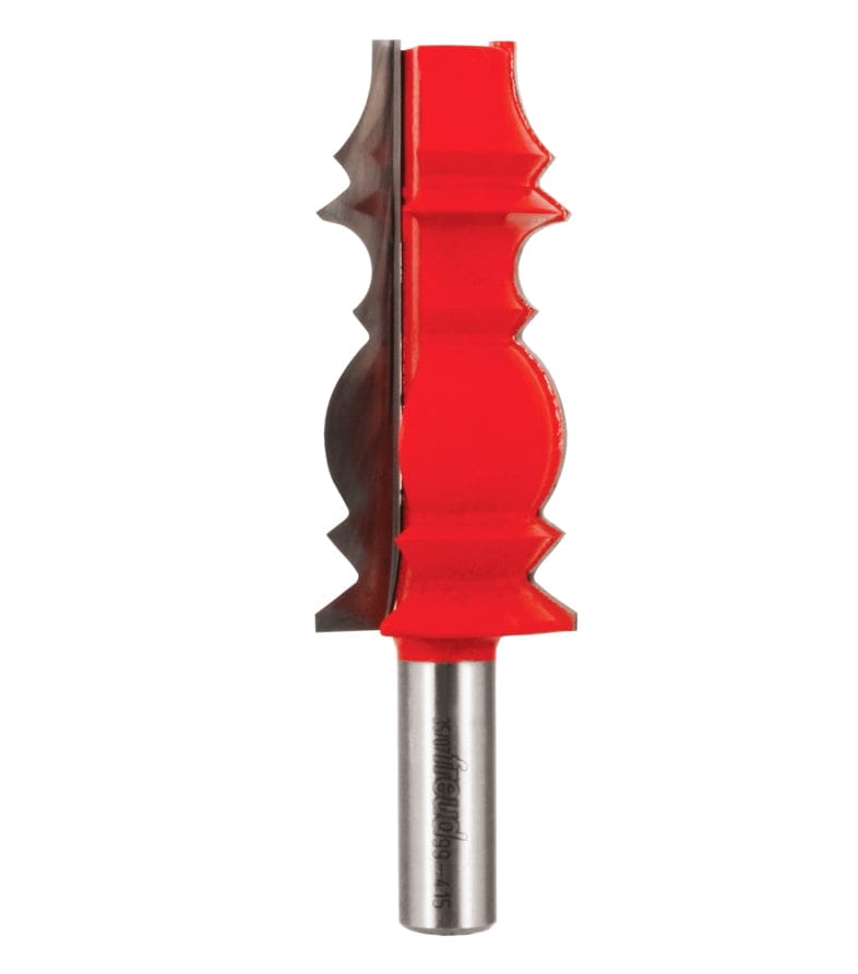 Studio shot of the Freud 99-415 wide crown molding router bit standing upright, featuring a tall red Perma-SHIELD body with carbide cutters on a 1/2 inch shank.