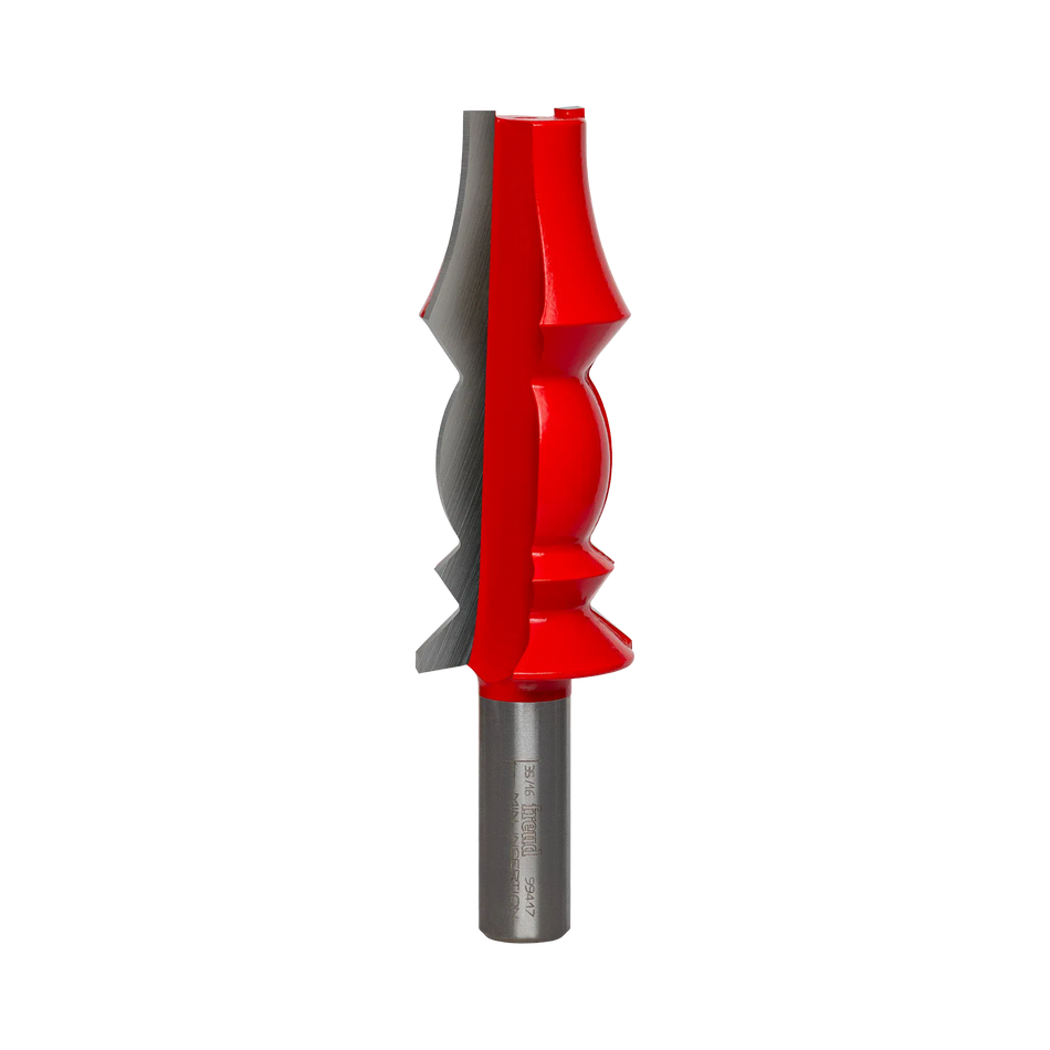 Studio shot of the Freud 99-417 wide crown molding router bit standing upright, featuring a tall red Perma-SHIELD body with carbide cutters on a 1/2 inch shank.