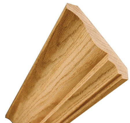 Rendering of a wood block displaying the detailed lower section of a crown molding profile, emphasizing the elegant curve and crisp edges produced by the bit.