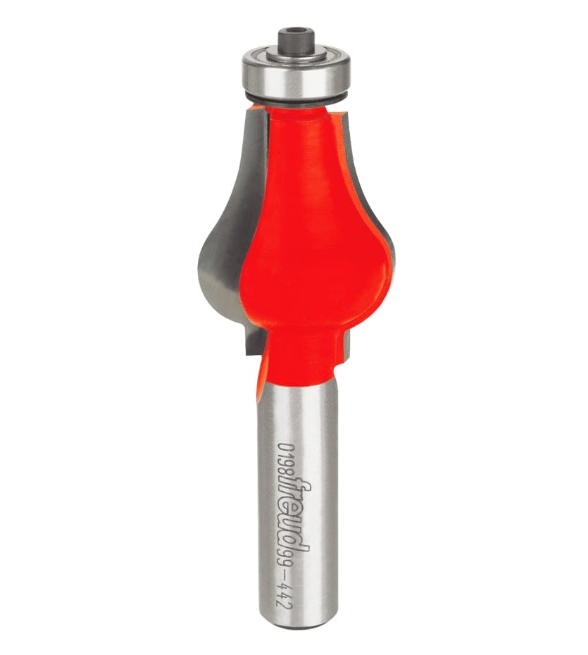 Studio shot of the Freud 99-442 handrail router bit standing upright, featuring a red Perma-SHIELD coating, carbide cutters, and a ball bearing guide on a 1/2 inch shank.