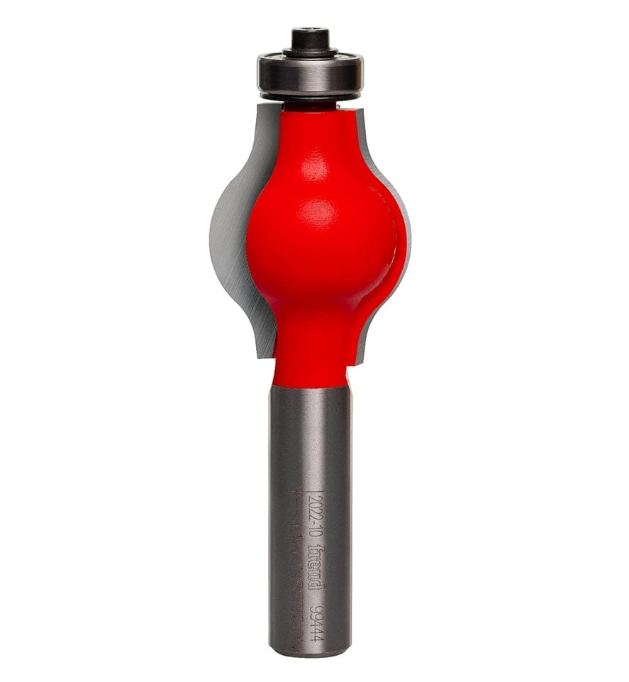 Studio shot of the Freud 99-444 handrail router bit standing upright, featuring a red Perma-SHIELD coating, carbide cutters, and a ball bearing guide on a 1/2 inch shank.