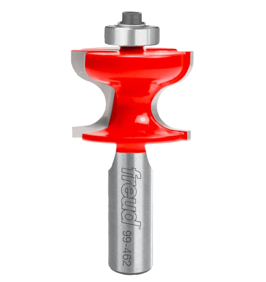 A close-up view of the Freud 99-462 window stool router bit featuring a vibrant red Perma-SHIELD coating, industrial-grade carbide cutters, and a top-mounted ball bearing guide for precise traditional molding profiles.