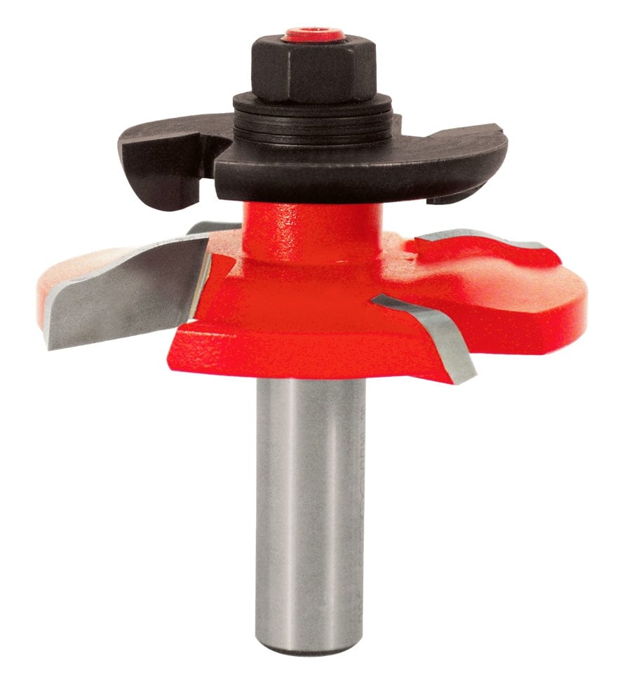 Studio shot of the Freud 99-500 raised panel router bit standing upright, featuring a red Perma-SHIELD coating, Quadra-Cut four-cutter design, and an integrated black back cutter on a 1/2 inch shank.