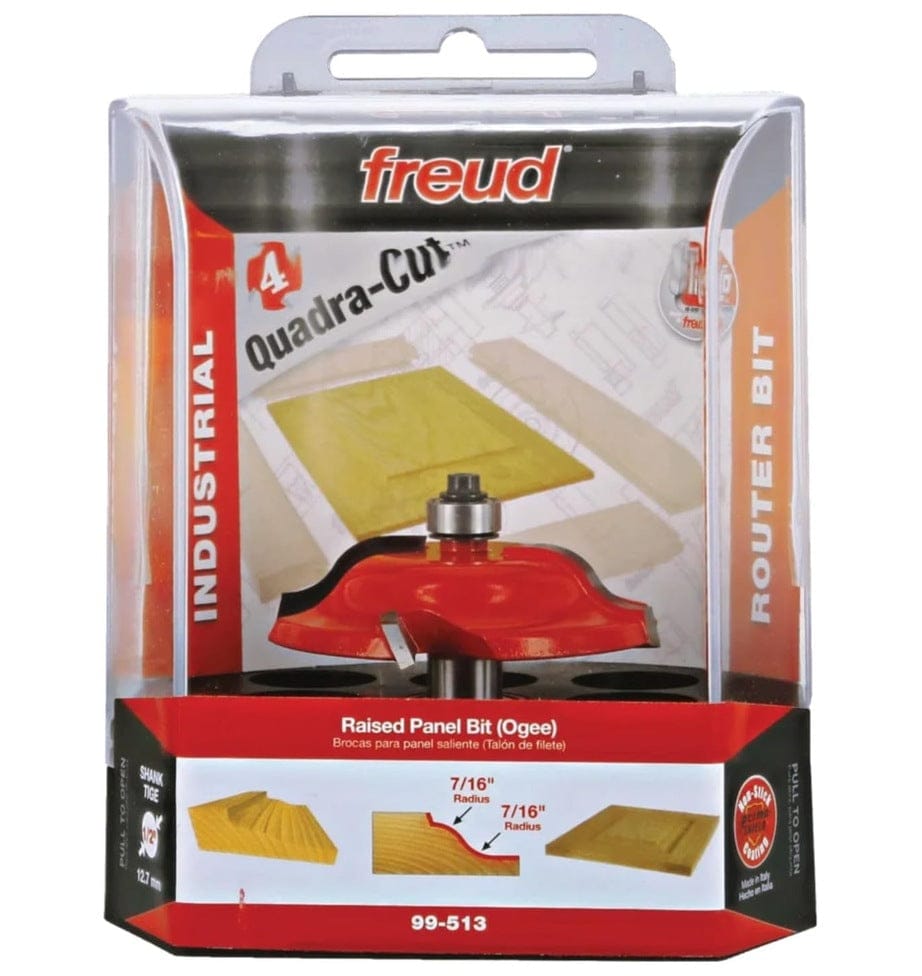 Retail clamshell packaging for the Freud 99-513 industrial raised panel bit, highlighting the Quadra-Cut 4-cutter design, Ogee profile, and 1/2 inch shank for professional woodworking.