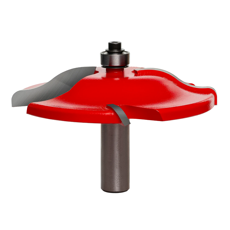 A high-resolution product shot of the Freud 99-520 3-1/2 inch Quadra-Cut raised panel router bit, featuring red carbide-tipped cutters and a 1/2 inch silver shank for professional woodworking.