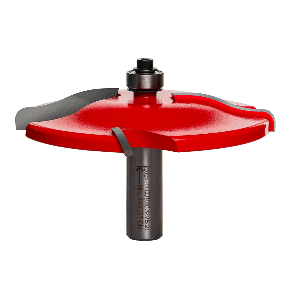 Studio shot of the Freud 99-521 Ogee Raised Panel Router Bit. This large diameter bit features a red Perma-SHIELD coated body with four Quadra-Cut wings, a 1/2-inch shank, and a top-mounted pilot bearing.