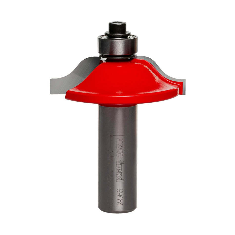 Freud router bit with red body, curved cutting edge, and bearing guide for shaping rounded wood edges.