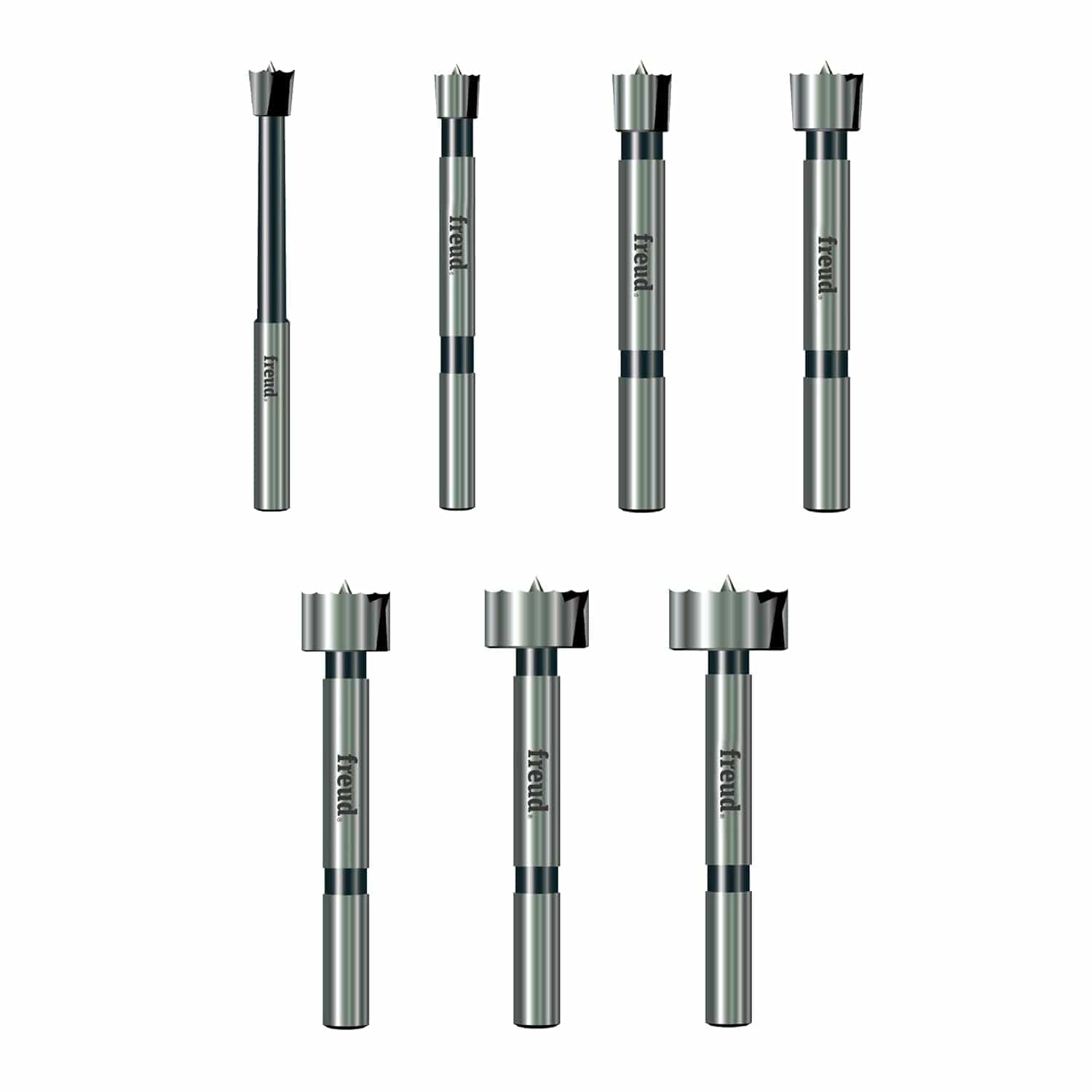 A studio shot of the Freud 7-piece precision shear Forstner bit set against a white background, highlighting the high-quality forged steel shanks and specialized serrated cutting edges.