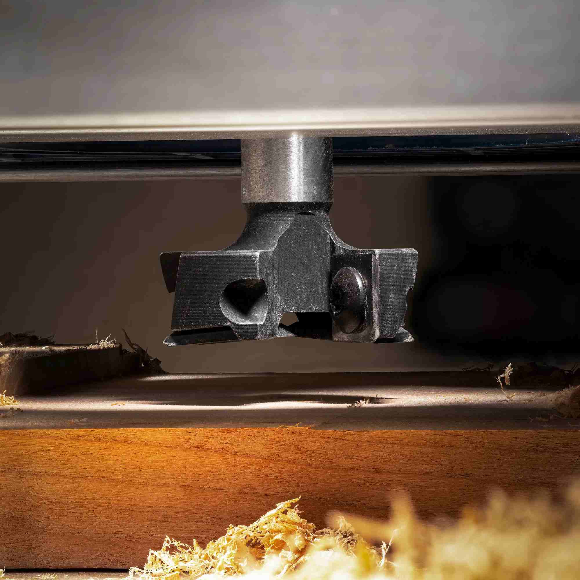 Illustration demonstrating the versatility of the Freud TM1465 1-1/2 inch surfacing and rabbeting bit for applications including precision mortising, clean dadoes, and accurate rabbeting cuts with a table-mounted router.