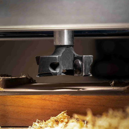 Illustration demonstrating the versatility of the Freud TM1465 1-1/2 inch surfacing and rabbeting bit for applications including precision mortising, clean dadoes, and accurate rabbeting cuts with a table-mounted router.