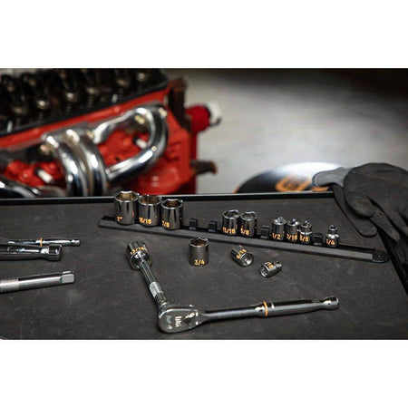 A professional workspace shot showing the GEARWRENCH 11-piece SAE Hi-Viz deep socket set on a black service cart next to an engine, illustrating organized tool management during heavy-duty maintenance.
